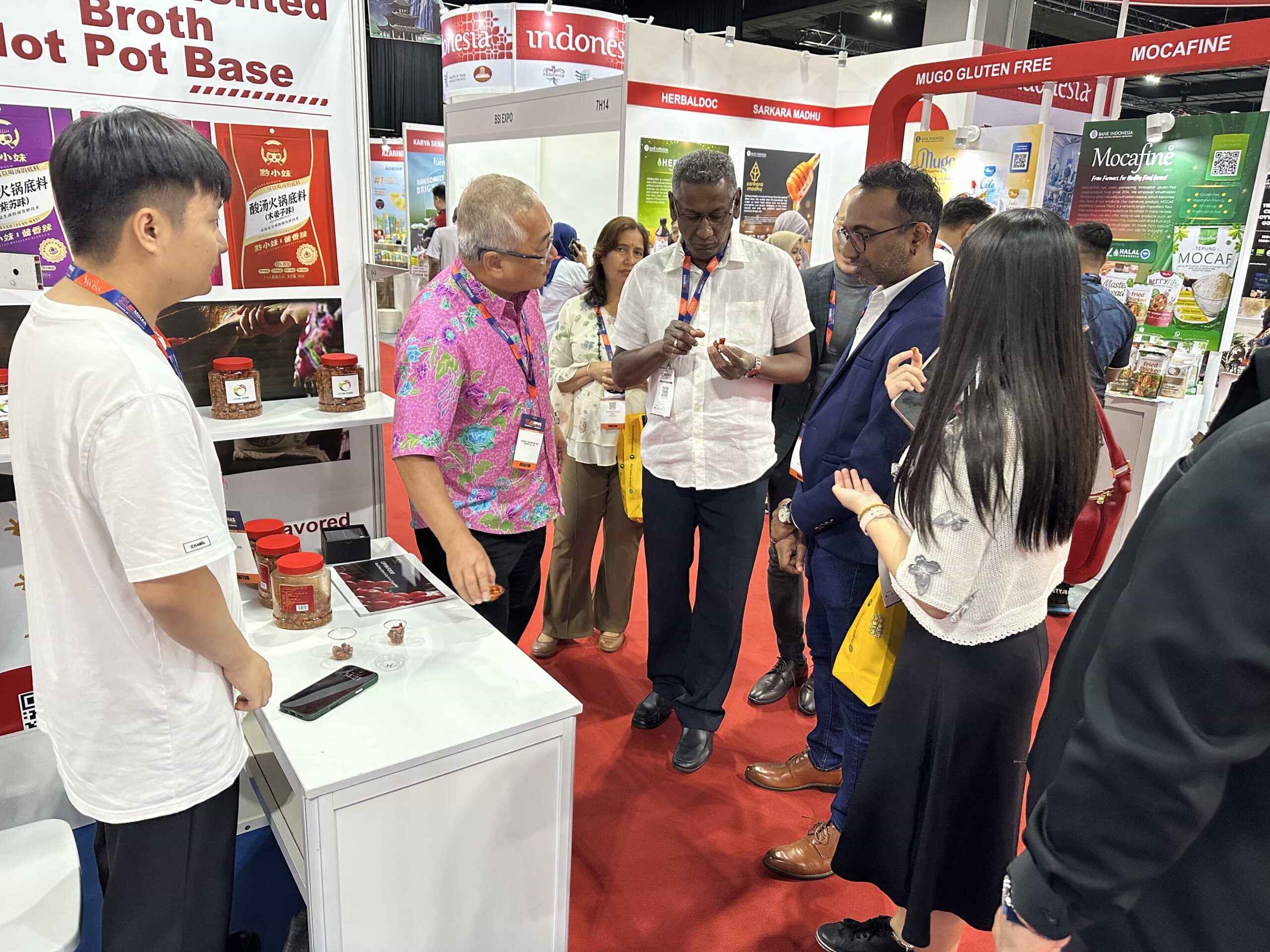 Buyers visiting Guizhou Lvyin Food booth at Malaysia Halal Food Expo
